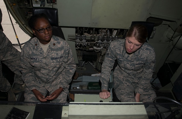 Maj. Venita Ramirez, 366th Aerospace Medicine Squadron public health flight commander, and Airman 1st Class Kiana Platte, 366th AMDS bioenvironmental engineering technicians, look at a control panel during a tour Sept. 19, 2016, at Mountain Home Air Force Base, Idaho. The C-130 is part of the 910th Air Wing stationed at Youngstown, Ohio. (U.S. Air Force photo by Senior Airman Malissa Lott/Released)