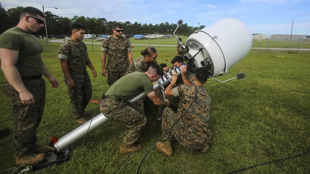 Marines practice setting up a Meteorological Radar Subsystem at Marine Corps Air Station New River, N.C., Sept. 14, 2016. The MRS was used by Marines with Meteorology and Oceanography platoon, 2nd Intelligence Battalion and Marine Air Traffic Control Detachment Bravo, Marine Air Traffic Control Squadron 2 to predict cloud cover, tropical storms and other possible weather systems in the area.