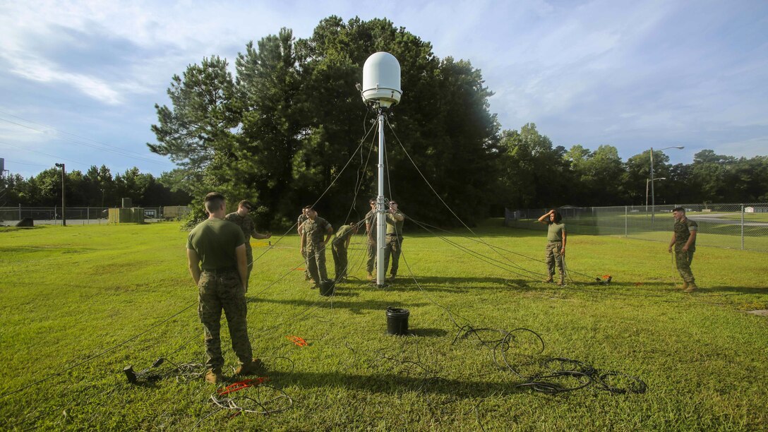 Marines set up a Meteorological Radar Subsystem at Marine Corps Air Station New River, N.C., Sept. 14, 2016. Marines from Meteorology and Oceanography platoon, 2nd Intelligence Battalion and Marine Air Traffic Control Detachment Bravo, Marine Air Traffic Control Squadron 2 worked hand-in-hand to properly set up the MRS while it was free-standing, a unique but difficult way to construct it.