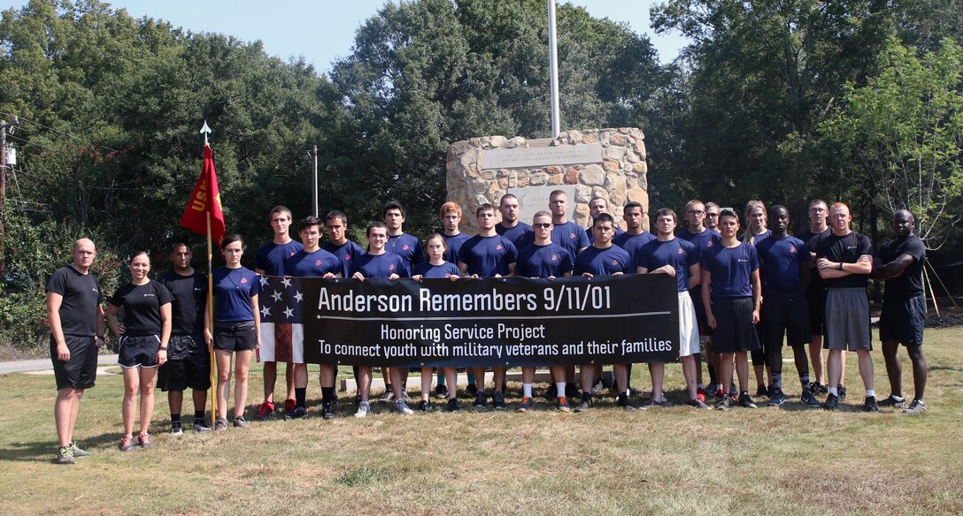 Marines and poolees from Recruiting Substation Anderson pose for a group photo while volunteering at Equinox Park in Anderson, S.C. on Saturday. Volunteers were at the park Saturday to beautify the park and the Vietnam Memorial inside it.
