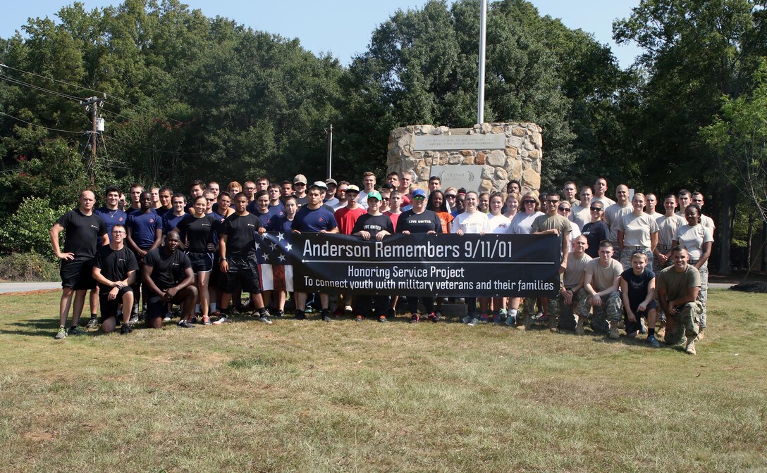 Volunteers pose for a group photo while volunteering at Equinox Park in Anderson, S.C. on Saturday. Volunteers were at the park Saturday to beautify the park and the Vietnam Memorial inside it.