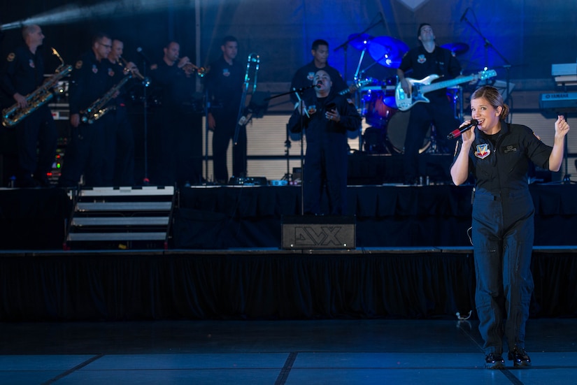 U.S. Air Force Senior Airman Melissa Lackore, U.S Air Force Heritage of America Band Full Spectrum vocalist, sings during the 100-year Gala celebration at the Hampton Roads Convention Center in Hampton, Va., Sept. 17, 2016. Full Spectrum plays a mix of “old school” hip-hop and current pop music trends to reach the generation’s youth and young adults. (U.S. Air Force photo by Airman 1st Class Derek Seifert)