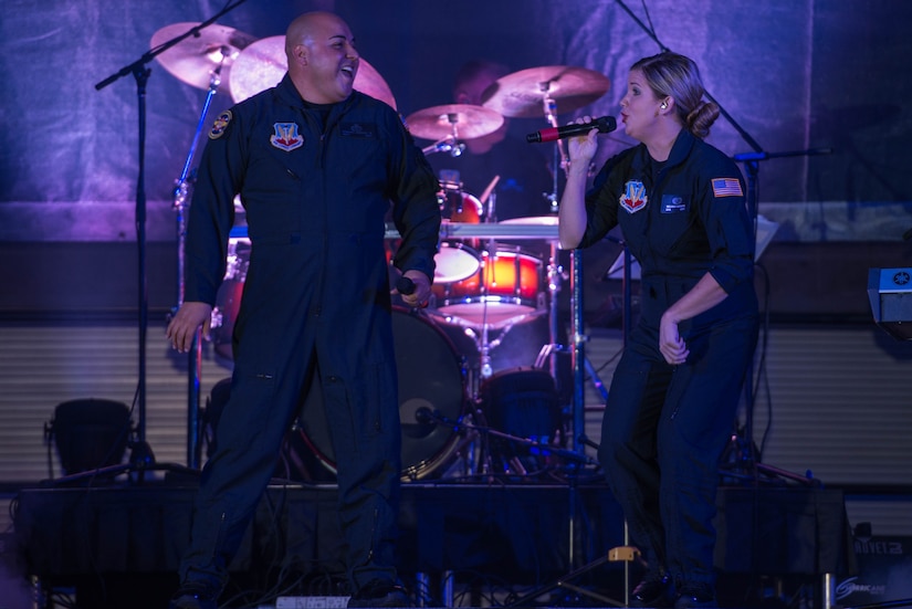 U.S. Air Force Master Sgt. Richard Vasquez Jr. and Senior Airman Melissa Lackore, U.S. Air Force Heritage of America Band vocalists, perform a duet during the 100-year Gala celebration at the Hampton Roads Convention Center in Hampton, Va., Sept. 17, 2016. The Heritage of America band was created by order of the Secretary of War on Oct. 1, 1941 and assigned to Barksdale Field, Louisiana and was later reassigned to Joint Base Langley-Eustis, Va. (U.S. Air Force photo by Airman 1st Class Derek Seifert)