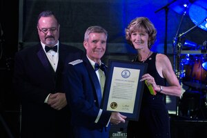 Karen Jackson, Virginia Secretary of Technology, gives a proclamation to U.S. Air Force Gen. Hawk Carlisle, commander of Air Combat Command, at the 100-year Gala celebration at the Hampton Roads Convention Center in Hampton, Va., Sept. 17, 2016. The proclamation was presented in honor of the 69th birthday of the U.S. Air Force. (U.S. Air Force photo by Airman 1st Class Derek Seifert)
