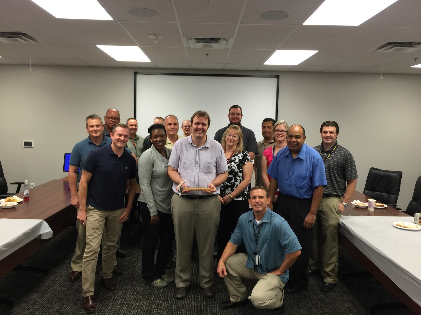 Bryce Griffith (center), enjoys time with his Defense Contract Management Agency Phoenix co-workers, mentors, Keystone coordinator and supervisor at the Orbital ATK facility in Chandler, Arizona. A graduation luncheon was held to recognize Griffith’s finishing the agency’s Keystone program. 