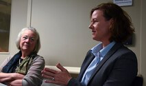 Stacy Cummings, Defense Healthcare Management Systems program executive officer, and Karen Guice, M.D., Assistant Secretary of Defense for Health Affairs, speaks to 92nd Medical Group leadership Sept. 7, 2016, at Fairchild Air Force Base, Wash. Cummings presented progress her team had made on the Military Health System Genesis program with the assistance of the 92nd MDG. (U.S. Air Force photo/Airman 1st Class Ryan Lackey)
