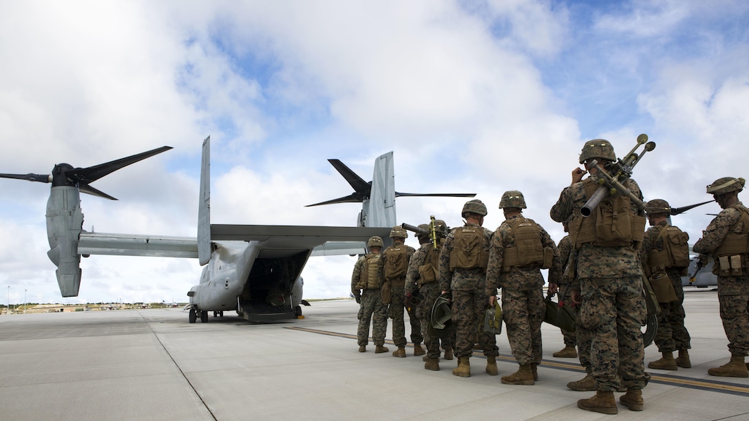 U.S. Marines with 3rd Battalion, 3rd Marine Regiment, prepare to board an MV-22B Osprey tiltrotor aircraft from Marine Medium Tiltrotor Squadron 262 (Reinforced), 31st Marine Expeditionary Unit on North Ramp, Andersen Air Force Base, Guam, during Exercise Valiant Shield 16, Sept. 20, 2016. The Kilo, 3/3 Marines departed to perform an airfiled seizure on Tinian for Valiant Shield. VS16 is a biennial U.S. only, field training exercise that focuses on joint training with U.S. Navy, Air Force and Marine Corps to increase interoperability and working relationships.