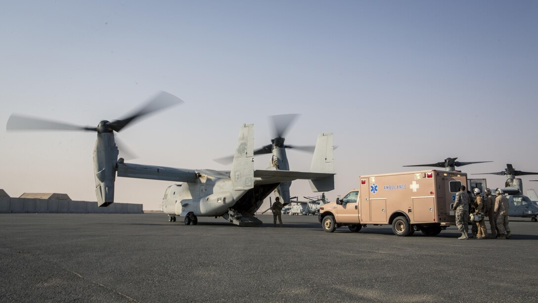 U.S. sailors with Special Purpose Marine Air-Ground Task Force - Crisis Response - Central Command, and Airmen with the 332nd Expeditionary Medical Group, transload a simulated casualty into an MV-22B Osprey with Marine Medium Tiltrotor Squadron 363, SPMAGTF-CR-CC, during a mass casualty exercise at an undisclosed location in Southwest Asia, Aug. 29, 2016. The exercise was conducted to ensure an effective response to a MASCAL situation in a joint environment.