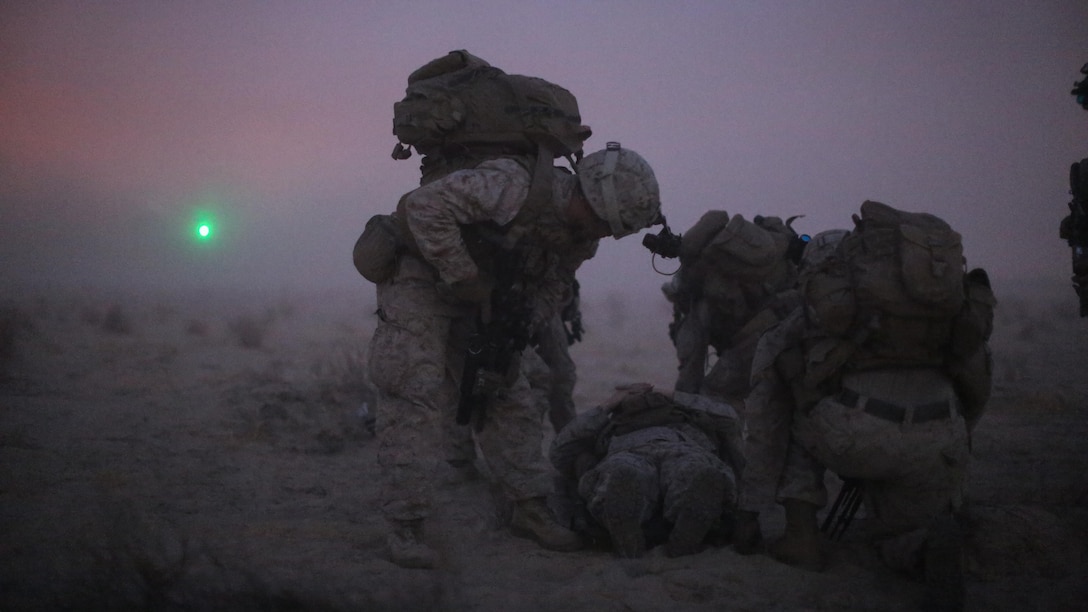 U.S. Marines with 2nd Battalion, 7th Marine Regiment, Special Purpose Marine Air-Ground Task Force - Crisis Response - Central Command, prepare to lift a simulated casualty during a Tactical Recovery of Aircraft and Personnel exercise, Aug. 29, 2016. U.S. Marines and Sailors assigned to Special Purpose Marine Air-Ground Task Force-Crisis Response-Central Command support operations, contingencies and security cooperation in Marine Corps Forces Central Command and U.S. Central Command area of responsibility. 