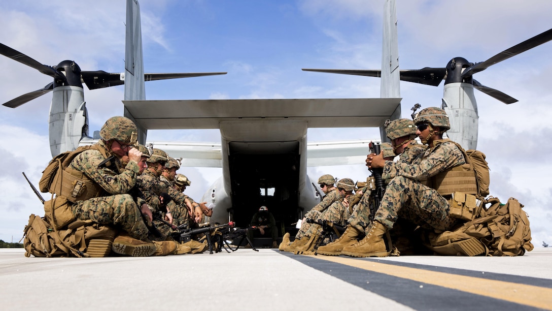 U.S. Marines with 3rd Battalion, 3rd Marine Regiment, wait to board an MV-22B Osprey tiltrotor aircraft from Marine Medium Tiltrotor Squadron 262 (Reinforced), 31st Marine Expeditionary Unit on North Ramp, Andersen Air Force Base, Guam, during Valiant Shield 16, Sept. 20, 2016. The Kilo 3/3 Marines departed to perform a airfiled seizure on Tinian for Valiant Shield. VS16 is a biennial U.S. only, field training exercise that focuses on joint training with U.S. Navy, Air Force and Marine Corps to increase interoperability and working relationships.