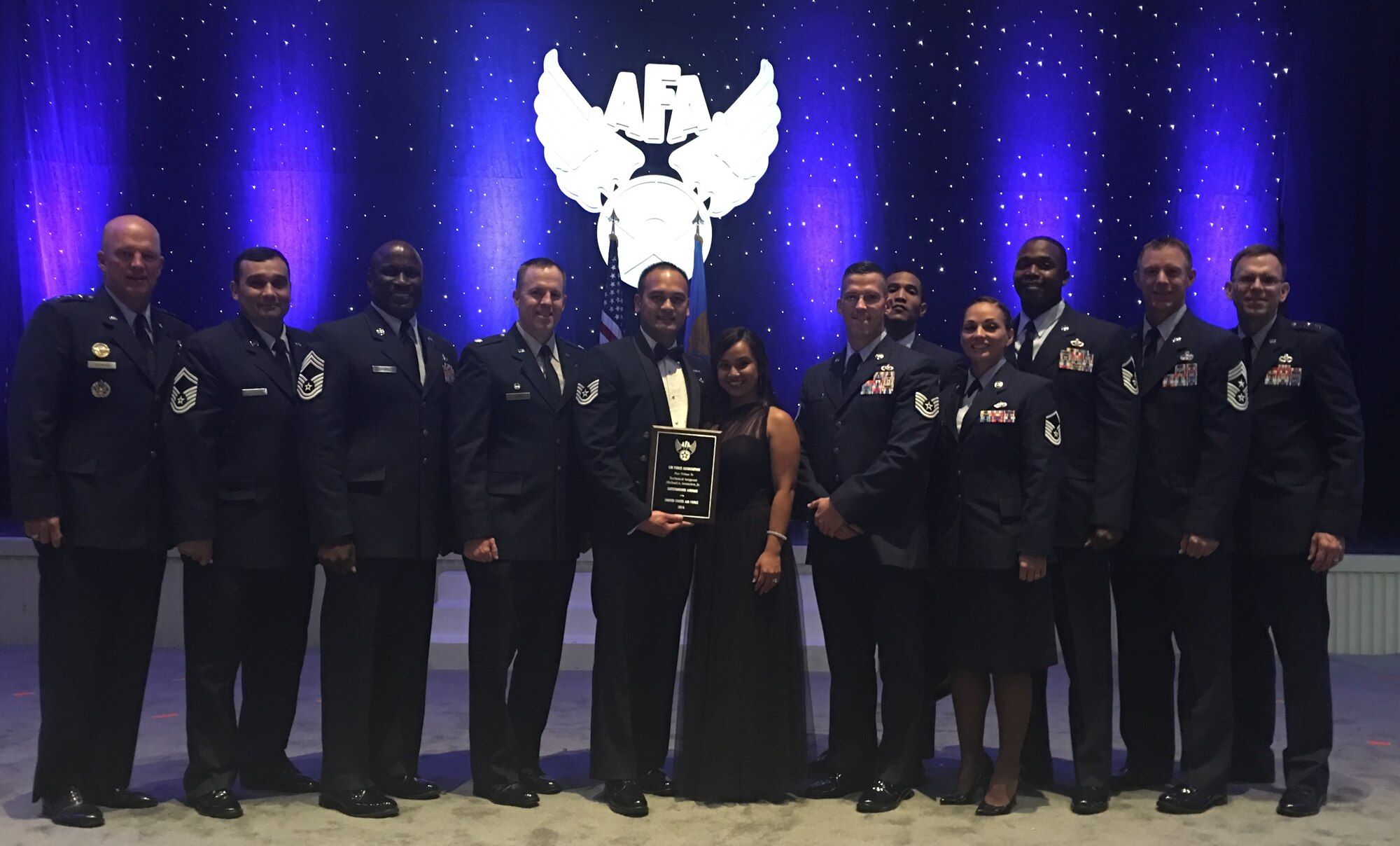 Tech. Sgt. Michael Asuncion Jr., 45th Civil Engineer Squadron Pavement and Equipment Craftsman, (holding award), was named one of the 12 Outstanding Airmen of the Year for 2016, for Air Force Space Command. Sept. 19, 2016, in Washington, D.C.  The Air Force Association proudly honored each Outstanding Airmen at its annual Air, Space & Cyber Conference held Sept. 19-21, 2016. (Courtesy photo) 