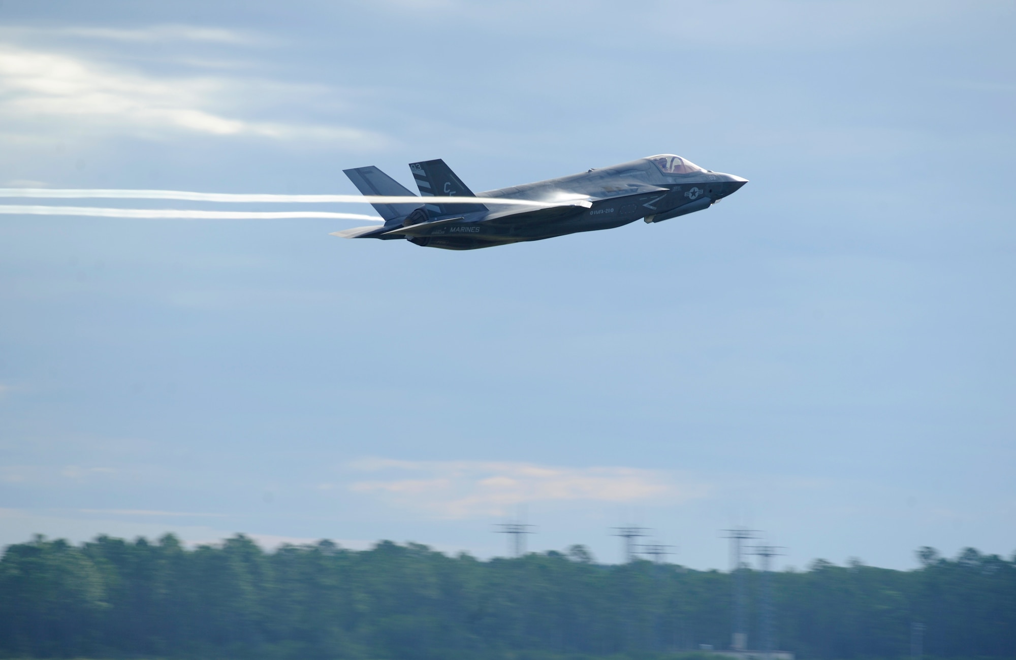 A U.S. Marine F-35 Lightning II from the Marine Fighter Attack Squadron (VMRA) 211, takes off just above the treeline during a 53rd Weapon Evaluation Group Weapon System Evaluation Program from the Tyndall flightline Sept. 16, 2016. This WSEP marked Marine Fighter Attack Squadron 211’s first deployment since standing up the unit on June 30, and was the first operational F-35 firing of a live air-to-air missile during Combat Archer. (U.S. Air Force photo by Senior Airman Solomon Cook/Released)