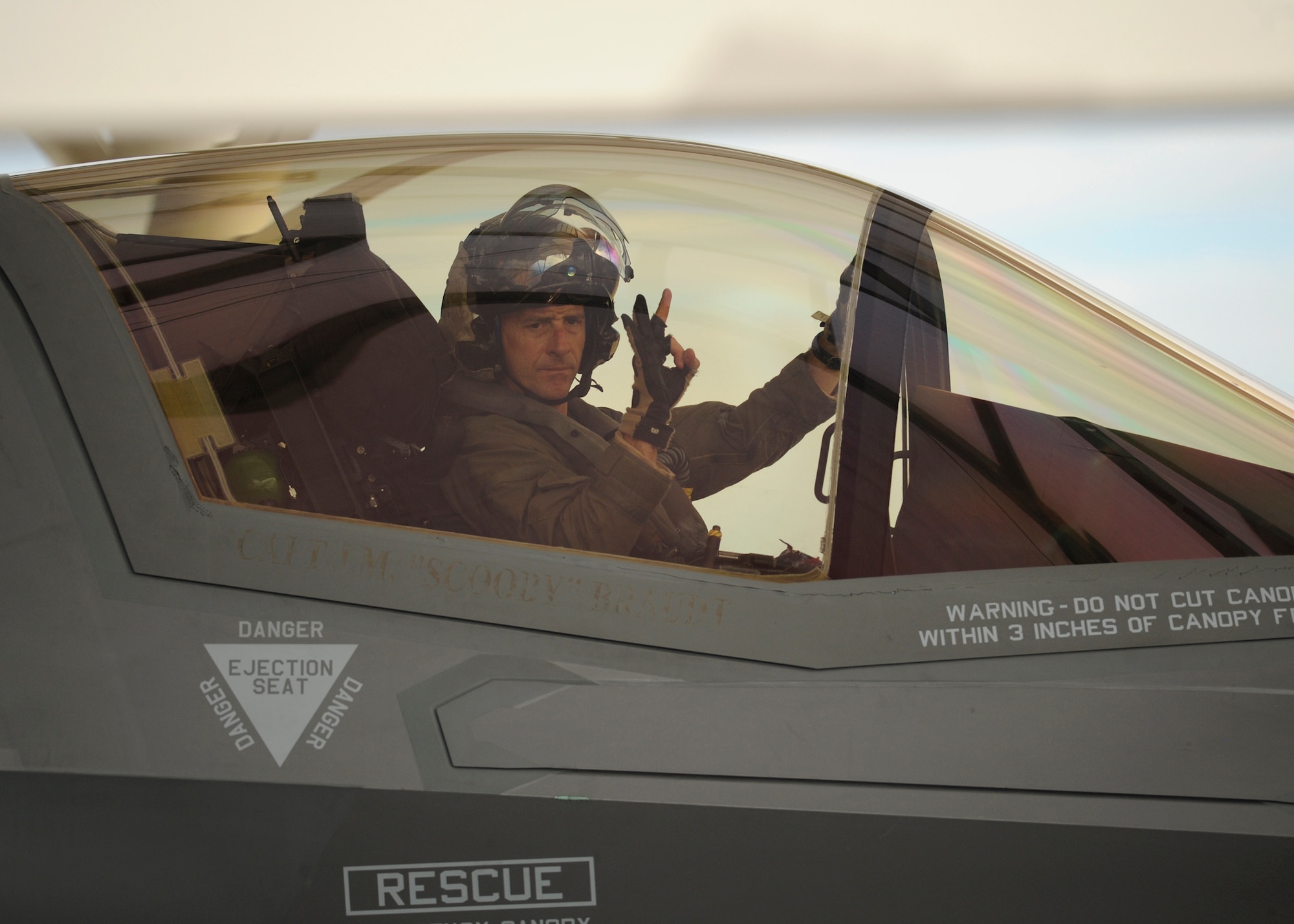 U.S. Marine Lt. Col. Chad Vaughn, commander of Marine Fighter Attack Squadron (VMFA) 211, signals to ground crew after returning from live air-to-air missile testing during Combat Archer on the Tyndall flightline Sept. 16, 2016. During Combat Archer VMFA brought four F-35s and 112 Marines to accomplish their mission. (U.S. Air Force photo by Senior Airman Solomon Cook/Released)