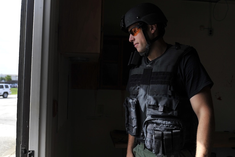 Master Deputy James Thomas, a hazardous device technician with the Charleston County Sheriff's Office, exits the crime scene area after collecting samples during a training scenario at here, Sept. 21, 2016.The local bomb squads often train with members from the 628th Civil Engineer Squadron's Explosive Ordnance Disposal flight to build relationships and streamline operating procedures between state and federal entities.