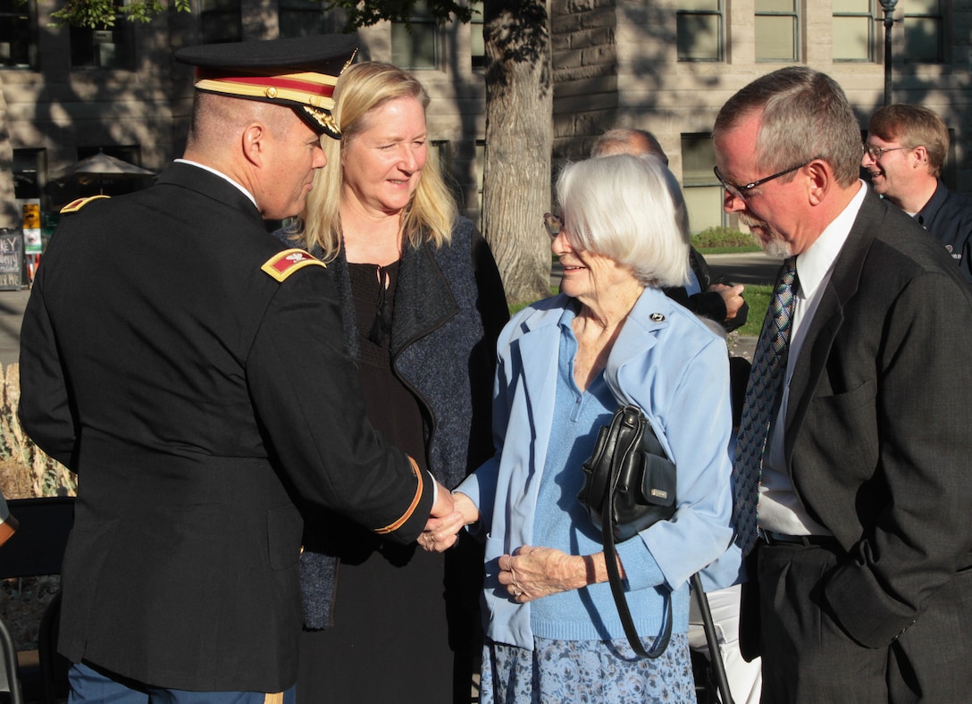 During a flagging ceremony for POW/MIA Day held at Salt Lake City, Utah, September 16, 76th Division Operational Response Chief of Staff, Col. Doug Cherry, shook hands with surviving relative of Sgt. William Andrews, whose airplane crashed during a bombing run and was later captured and executed by the Japanese during World War II, along with several of his crews on board.  His remains have never been returned.