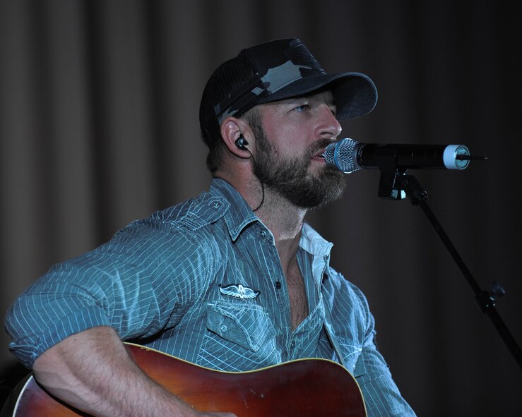 Kyle Jennings, a country music artist, plays an acoustic guitar during his concert at Barksdale Air Force Base, La., Sept. 16, 2016. Jenning’s genre of music is primarily country but he infuses blues, folk, and rock and roll into his songs. (U.S. Air Force photo/Airman 1st Class Stuart Bright)