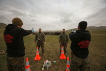 U.S. Marines with 3rd Law Enforcement Battalion, III Marine Expeditionary Force, spray Mongolian Armed Forces soldiers with oleoresin capsicum during Non-Lethal Weapons Executive Seminar (NOLES) 2016 at the Five Hills Training Area, Mongolia, Sept. 17, 2016. Mongolian soldiers and National Police were exposed to oleoresin capsicum spray and had to complete a five-level circuit course. Non-lethal weapons are designed to incapacitate equipment and personnel while minimizing fatalities and permanent injury to personnel, and undesired collateral damage to property. 