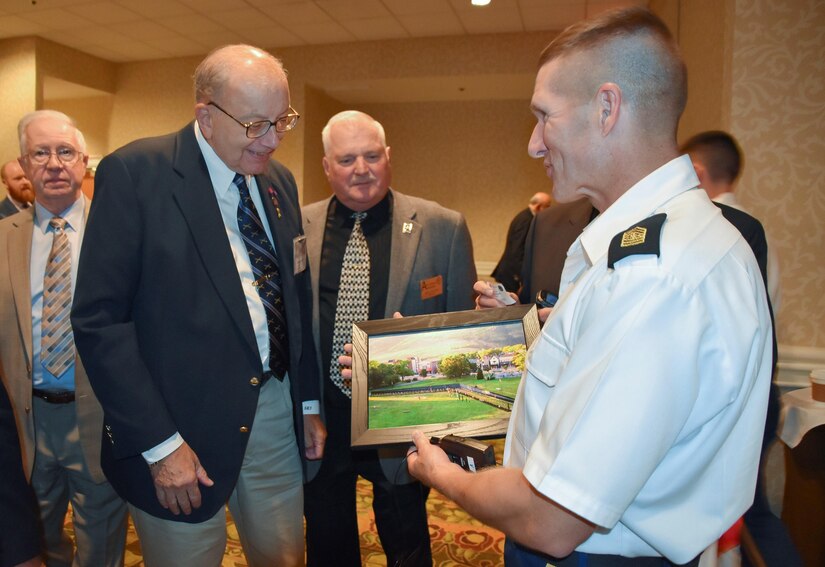 Pennsylvania Army Reserve Ambassador George H. Duell, Jr. presents Sgt. Maj. of the Army Daniel Dailey, a framed photo of the Vietnam Moving Wall, which was located in Dailey’s hometown of Palmerton, Pennsylvania, Sept. 16, 2016.  Dailey was a guest speaker at the annual Army Reserve Ambassador Forum and discussed the Army’s top priorities with the group. (U.S. Army Reserve photo by Master Sgt. Marisol Walker/Released)
