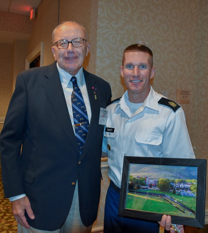 Pennsylvania Army Reserve Ambassador George H. Duell, Jr. and Sgt. Maj. of the Army Daniel Dailey, pose for a photo at the Army Reserve Ambassador Forum, Sept. 16, 2016.  Duell, Dailey’s high school principal, presented him with a framed photo of the Vietnam Moving Wall, which was located in Dailey’s hometown of Palmerton, Pennsylvania.  (U.S. Army Reserve photo by Master Sgt. Marisol Walker/Released)