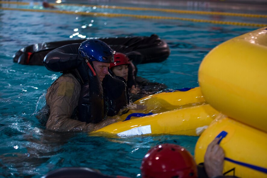 John Ryland, 81st Fighter Squadron A-29 Super Tucano civilian pilot, climbs into a 20-man raft during water survival training, Sept. 15, 2016, at Moody Air Force Base, Ga. Aircrew members must be trained every 36 months to practice their water survival skills with a multitude of gear and scenarios to be prepared in the event of an aircraft incident. (U.S. Air Force photo by Airman 1st Class Greg Nash)
