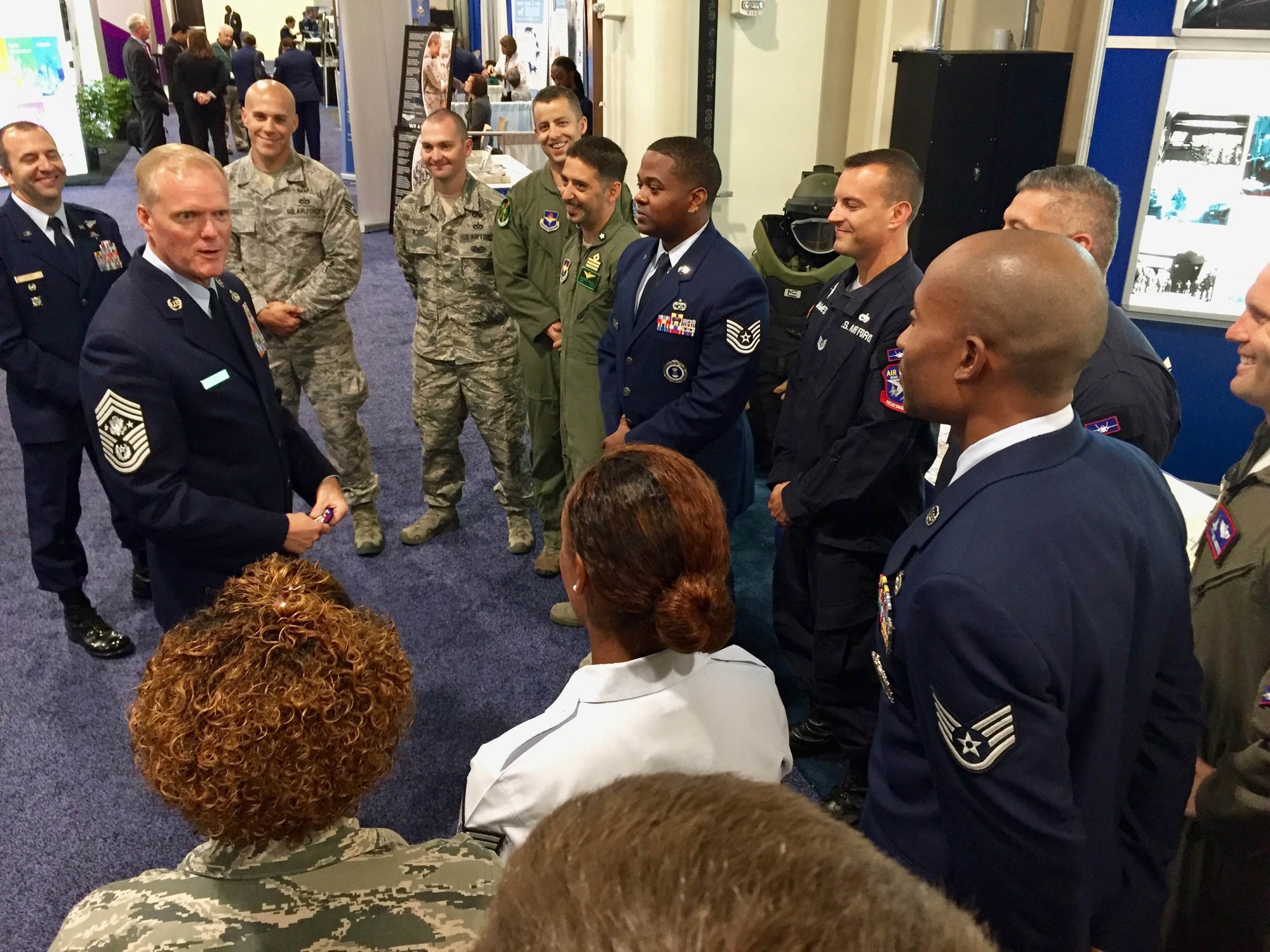 Chief Master Sgt. of the Air Force James A. Cody speaks with Air Education and Training Command Airmen at the 2016 Air, Space and Cyber Conference in National Harbor, Md., Sept. 21, 2016. At the AETC booth, conference attendees had the opportunity to mingle with a military training instructor, battlefield Airmen, Air Force recruiters, explosive ordnance disposal Airmen, international pilots, a special experience identifier instructor and members of the F-35 Heritage Flight Team. (U.S. Air Force photo by Senior Airman Chip Pons)