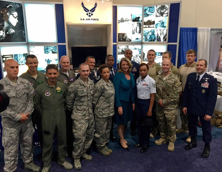 Air Force Secretary Deborah Lee James poses for a photo with Air Education and Training Command Airmen at the 2016 Air, Space and Cyber Conference, National Harbor, Md., Sept. 21, 2016. First Command Airmen from various career fields representing AETC showcased their capabilities, professionalism and innovation for conference attendees. (U.S. Air Force photo by Senior Airman Chip Pons) 