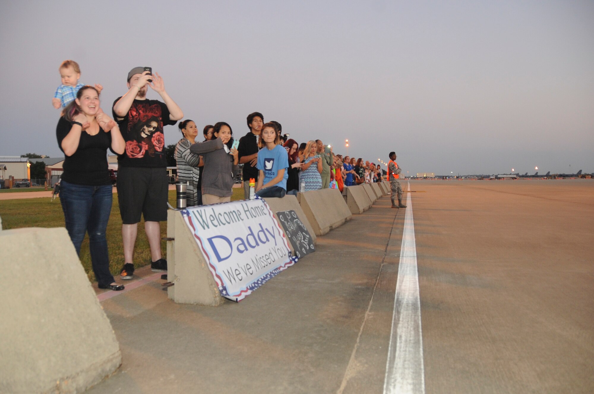 Family and friends welcome Airmen who are returning from their deployment to Barksdale Air Force Base, La., Sept. 19, 2016. More than 400 Airmen from the 11th, 20th and 96th bomb squadron and the 2nd Operations Support Squadron were deployed for more than five months to support Operation Inherent resolve. (U.S. Air Force photo/Airman Alexis C. Schultz)