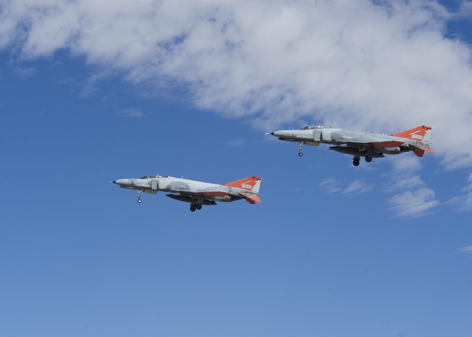 Two QF-4 Phantom IIs fly in formation over Holloman Air Force Base, N.M. on Sept. 13, 2016, in front of 160 spectators participating in Holloman’s annual Phantom Society Tour. The tour enabled aircraft enthusiasts, including veterans and non-veterans with aviation backgrounds, to learn more about Holloman AFB’s aircraft and mission. The tour included an F-16 Fighting Falcon static display and briefing, travel to Holloman’s High Speed Test Track, the opportunity to view QF-4 Phantom IIs and F-16s in flight, and a visit to the base’s heritage park to view static displays of various aircraft historically stationed at Holloman AFB. (U.S. Air Force photo by Master Sgt. Matthew McGovern)