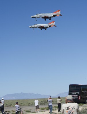 Two QF-4 Phantom IIs fly in formation over Holloman Air Force Base, N.M. on Sept. 13, 2016, in front of 160 spectators participating in Holloman’s annual Phantom Society Tour. The tour enabled aircraft enthusiasts, including veterans and non-veterans with aviation backgrounds, to explore various base locations. The tour included an F-16 Fighting Falcon static display and briefing, travel to Holloman’s High Speed Test Track, the opportunity to view QF-4 Phantom IIs and F-16s in flight, and a visit to the base’s heritage park to view static displays of various aircraft historically stationed at Holloman AFB. (U.S. Air Force photo by Master Sgt. Matthew McGovern)