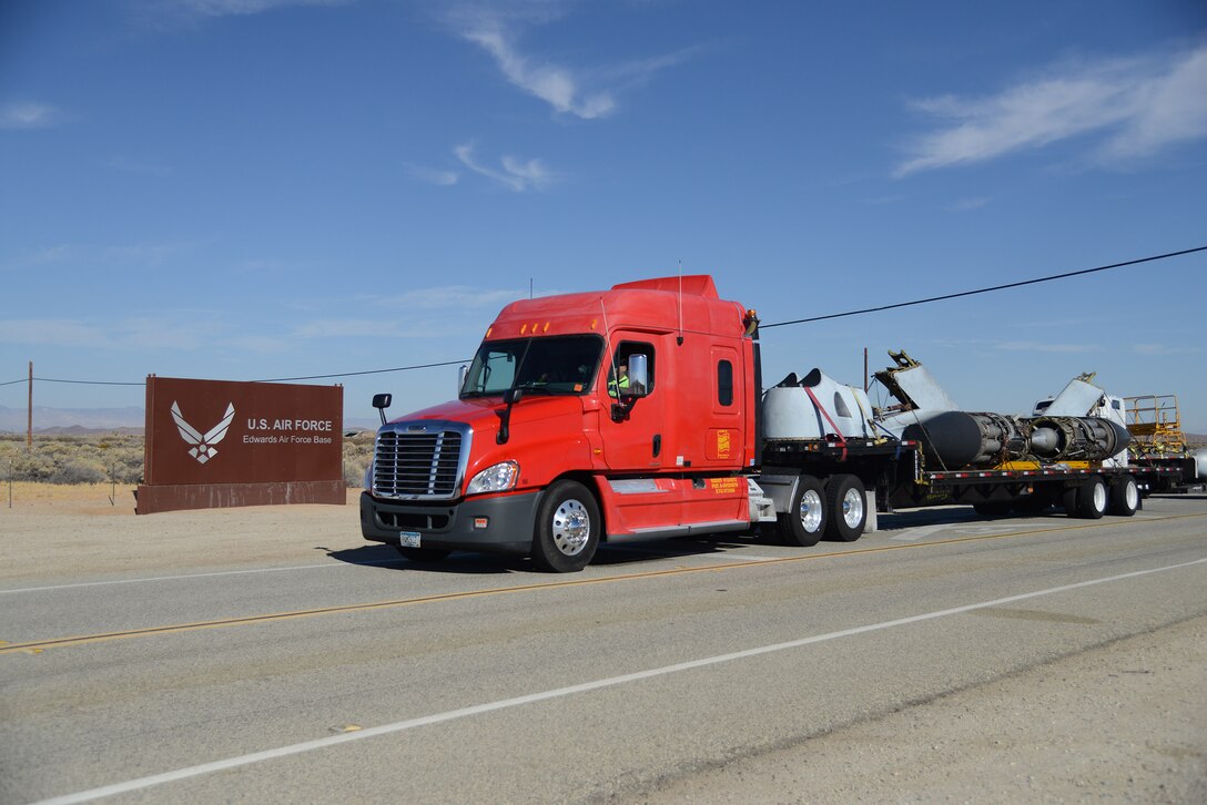 A flatbed truck hauling engines and other aircraft components of the XB-47A Stratojet enters the northern boundary of Edwards Air Force Base Sept. 19. The historic aircraft returned to Edwards Air Force Base after more than six decades on display at Chanute Air Force Base, Illinois. It will eventually be reassembled and displayed at the Air Force Flight Test Museum. (U.S. Air Force photo by Christopher Ball)