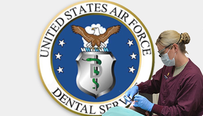 Air Force Maj. Heather Deloney, 477th Fighter Group dentist, performs a scheduled dental exam on Master Sgt. Brian Knipsel during the September unit training assembly at Joint Base Elmendorf-Richardson, Alaska. The 477 AMDF Dental Lab offers more than 300 reservists routine dental care in its mission to provide mission-ready warfighters to the combatant commander.