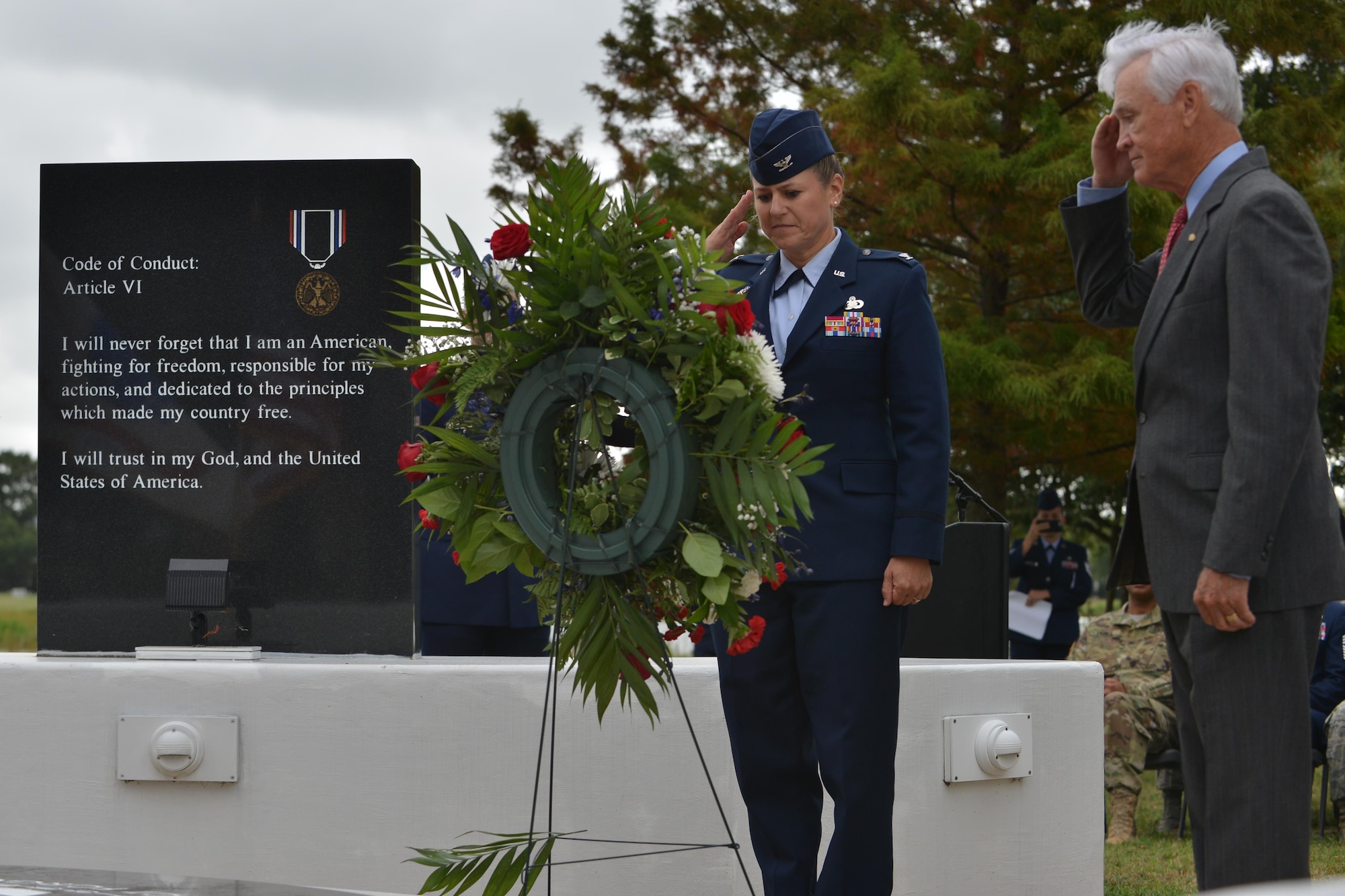 U.S. Air Force Col. Caroline M. Miller, 633rd Air Base Wing commander, and retired U.S. Air Force Lt. Col. Barry B. Bridger, former Vietnam War prisoner of war, salute the POW/MIA wreath at the POW/MIA Recognition Day ceremony at Joint Base Langley-Eustis, Va., Sept. 16, 2016. Observances of National POW/MIA Recognition Day are held across the country on military installations, ships at sea, state capitols, schools and veterans' facilities. (U.S. Air Force photo by Staff Sgt. Natasha Stannard)