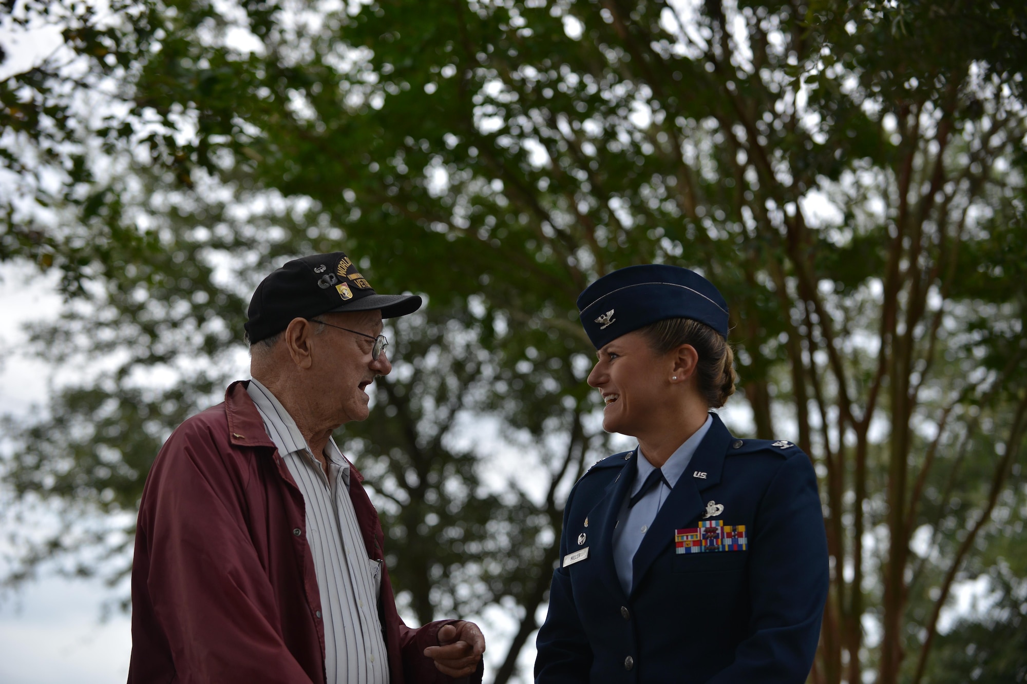 U.S. Air Force Col. Caroline M. Miller, 633rd Air Base Wing commander, speaks with Allen Ordorff, a World War II veteran, before the POW/MIA Recognition Day ceremony at Joint Base Langley-Eustis, Va., Sept. 16, 2016. While serving in the European theater during World War II, Orndorff was a member of the unit that found and liberated the Nazi concentration camp Dachau. (U.S. Air Force photo by Staff Sgt. Natasha Stannard)