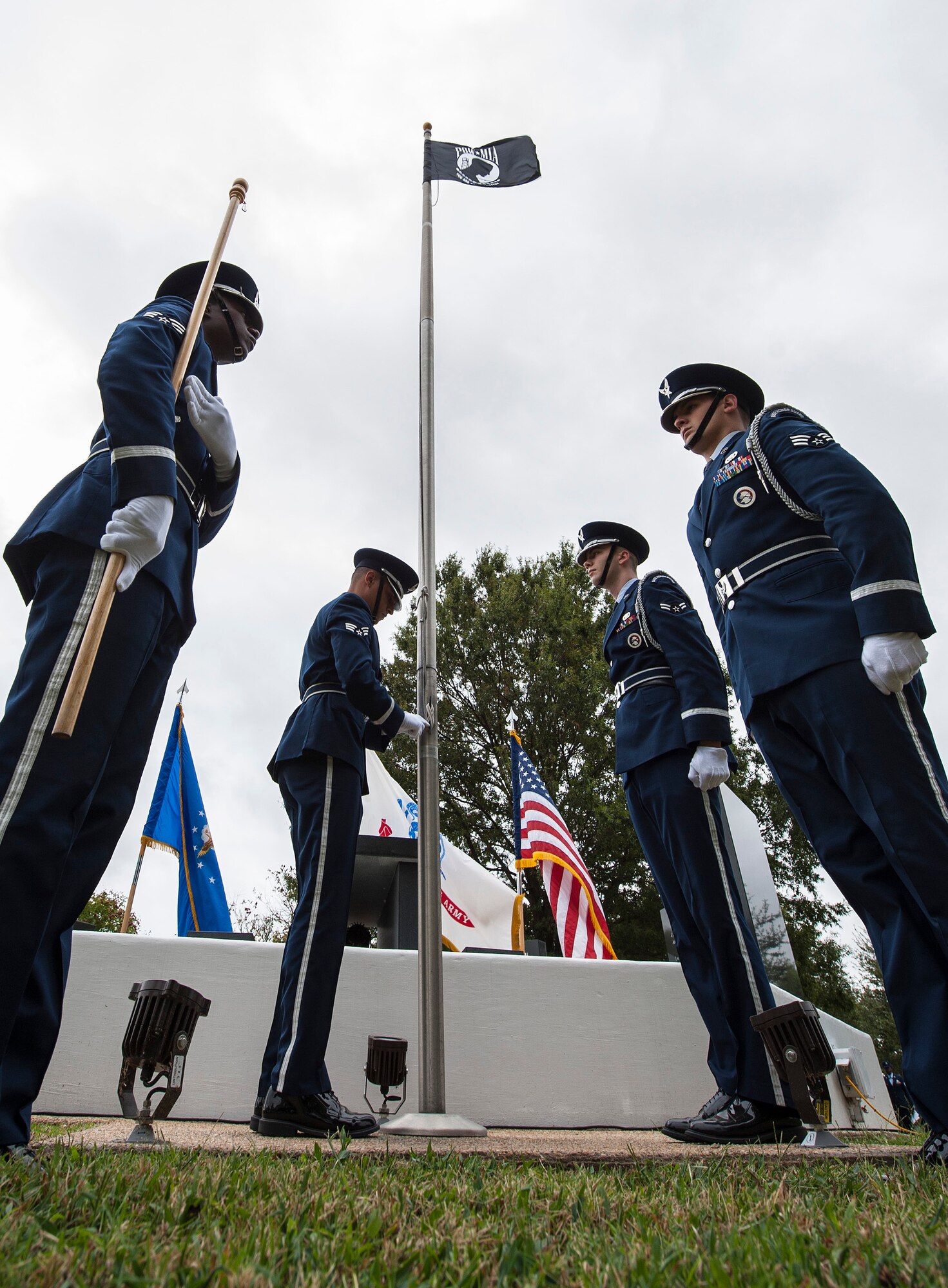 Members of the 633rd Air Base Wing Honor Guard raise the Prisoner of War/Missing in Action flag during a POW/MIA closing ceremony at Joint Base Langley-Eustis, Va., Sept. 16, 2016. In addition to the ceremony, Service members participated in a 24-hour run, during which they ran with the POW/MIA flag to recognize the sacrifices made by those missing in action or those who suffered as prisoners of war. (U.S. Air Force photo by Staff Sgt. Nick Wilson/Released)