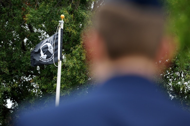 An Airman from the 633rd Air Base Wing stands at attention during a Prisoner of War/Missing in Action closing ceremony at Joint Base Langley-Eustis, Va., Sept. 16, 2016. The ceremony was held to give Team Langley’s community an opportunity to honor those who survived and remember those who still remain. (U.S. Air Force photo by Staff Sgt. Nick Wilson/Released)