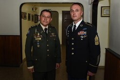 Cmd. Sgt. Maj. of the Honduran Army Forces Carlos Valle and U.S. Army Cmd. Sgt. Maj. Shawn Carns, Joint Task Force-Bravo command sergeant major, pose for a photo before a Honduran Army NCO academy graduation in Zambrano, Honduras, Aug. 25, 2016. Valle and Carns will conduct battlefield circulations to each one of the Honduran military’s NCO academies to see how they might improve upon and learn from their program of instruction. 