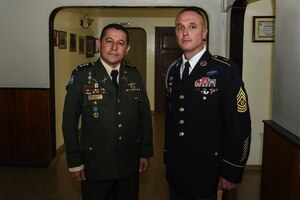 Cmd. Sgt. Maj. of the Honduran Army Forces Carlos Valle and U.S. Army Cmd. Sgt. Maj. Shawn Carns, Joint Task Force-Bravo command sergeant major, pose for a photo before a Honduran Army NCO academy graduation in Zambrano, Honduras, Aug. 25, 2016. Valle and Carns will conduct battlefield circulations to each one of the Honduran military’s NCO academies to see how they might improve upon and learn from their program of instruction. 