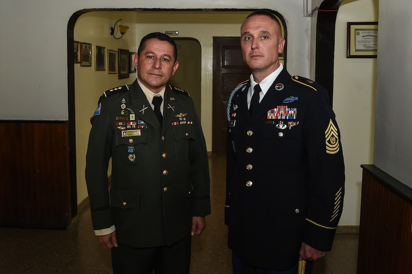 Cmd. Sgt. Maj. of the Honduran Army Forces Carlos Valle and U.S. Army Cmd. Sgt. Maj. Shawn Carns, Joint Task Force-Bravo command sergeant major, pose for a photo before a Honduran Army NCO academy graduation in Zambrano, Honduras, Aug. 25, 2016. Valle and Carns will conduct battlefield circulations to each one of the Honduran military’s NCO academies to see how they might improve upon and learn from their program of instruction. 