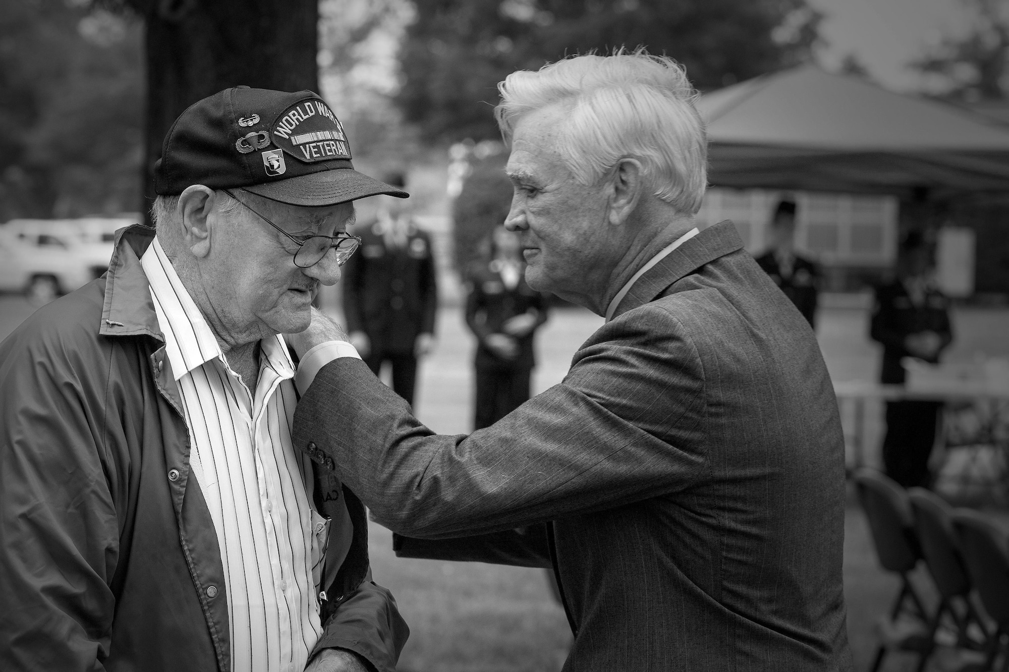 Allen Orndorff, a World War II veteran from the 101st Airborne Division, and Lt. Col. (ret.) Barry Bridger, a six-year POW during the Vietnam War, speak of war stories after a Prisoner of War/Missing in Action closing ceremony at Joint Base Langley-Eustis, Va., Sept. 16, 2016. Although the wars Orndorff and Bridger fought in were both more than 50 years ago, the memories they have still remain. The POW/MIA ceremony was held to pay tribute to all POWs and those missing in action from all wars, past and present. (U.S. Air Force photo by Staff Sgt. Nick Wilson)