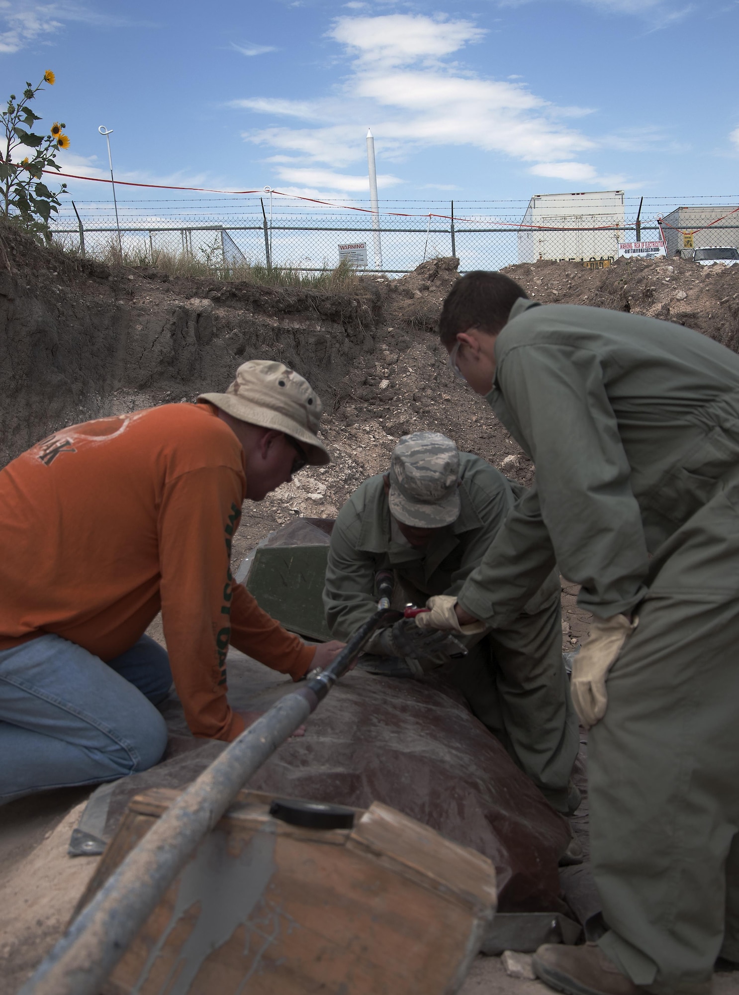 A 90th Missile Maintenance Squadron hardened inter-site cable systems team prepares a HICS cable outside a launch facility in the F.E. Warren Air Force Base, Wyo., missile complex Aug. 23, 2016. HICS Airmen maintain the network cables between launch facilities and missile alert facilities, which involves responding to any connectivity issues, similar to the 90th Communications Squadron on base. HICS is part of the 90th MMXS which maintains 150 Minuteman III ICBMs and the associated launch facilities spread between three states and 9,600 square-miles. (U.S. Air Force photo by Senior Airman Brandon Valle)