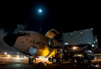 A U.S. Air Force 909th Air Refueling Squadron KC-135 Stratotanker receives 18th Aeromedical Evacuation Squadron cargo Sept. 12, 2016, at Kadena Air Base, Japan. The Stratotanker served as tanker support for Republic of Korea Air Force F-15 Eagles for a refueling exercise and as an aerial platform for 18th AES Airmen to perform a flight check of patient care procedures. (U.S. Air Force photo by Senior Airman Peter Reft)