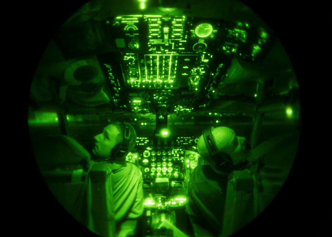 U.S. Air Force Capt. Kyle Gadoury, 909th Air Refueling Squadron KC-135 Stratotanker pilot, and Maj. Jacob Johnson, 909th ARS KC-135 instructor pilot, perform a pre-flight check for a nighttime training mission Sept. 12, 2016, at Kadena Air Base, Japan. Gadoury and Johnson flew as refueling support for Republic of Korea Air Force F-15 Eagles, and they also trained with 18th Aeromedical Evacuation Squadron aircrews for in-flight patient care and emergencies. (U.S. Air Force photo by Senior Airman Peter Reft)