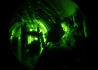 Capt. Nathan Sprague, 18th Aeromedical Evacuation Squadron flight nurse instructor, reviews mission data during a nighttime training mission Sept. 12, 2016, at Kadena Air Base, Japan. Sprague evaluated 18th AES aircrew’s performance in various medical and in-flight emergency procedures during a flight on a 909th Air Refueling Squadron KC-135 Stratotanker. (U.S. Air Force photo by Senior Airman Peter Reft)