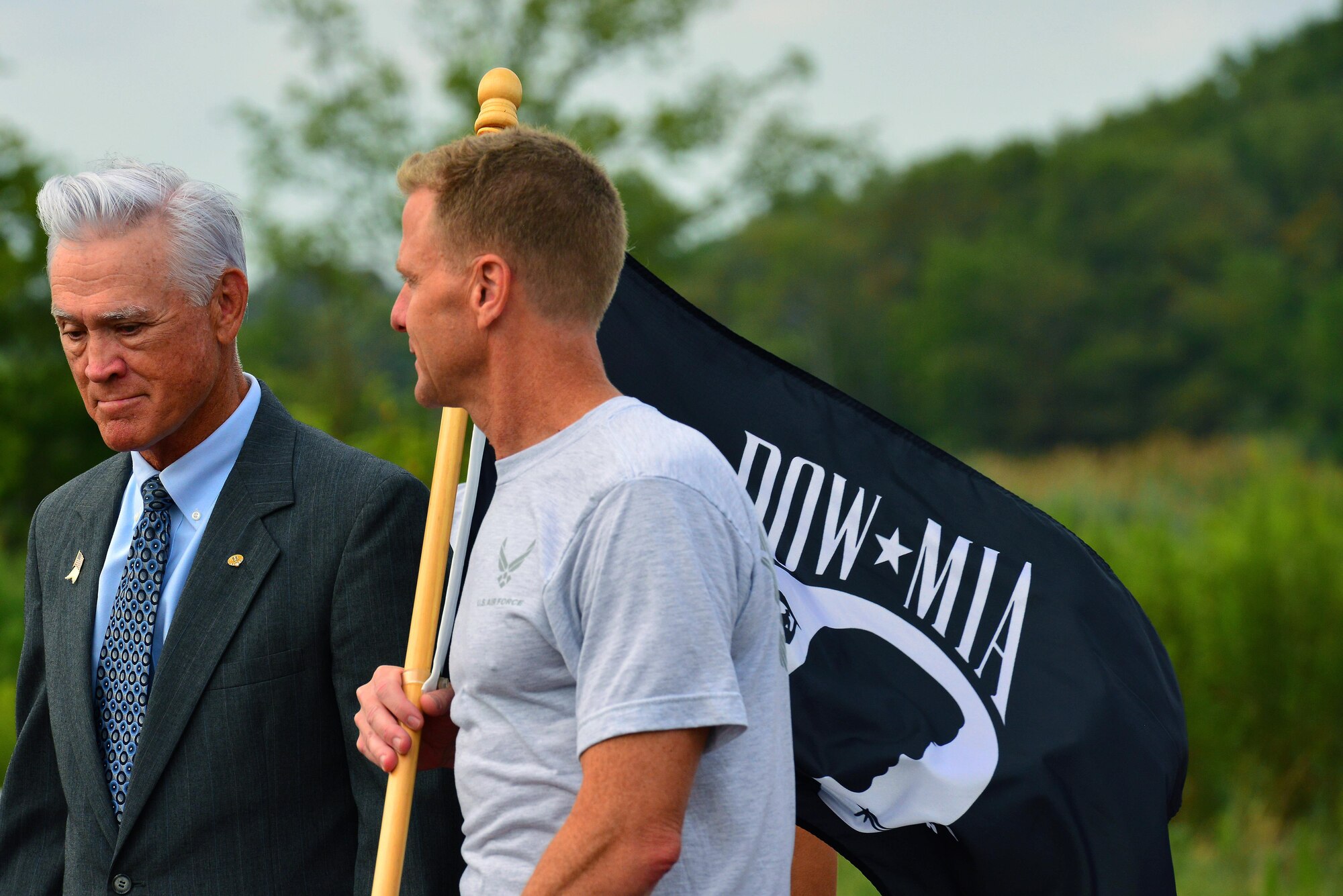 U.S. Air Force Col. Donald Borchelt, 1st Fighter Wing vice commander, and U.S. Air Force retired Lt. Col. Barry Bridger, begin the 24-hour run to honor all prisoners of war and service members missing in action during the National POW/MIA Recognition Day ceremony at Joint Base Langley-Eustis, Va., Sept. 15, 2016. Bridger was a prisoner of war in “Hanoi Hilton” prison camp for six years during the Vietnam War. (U.S. Air Force photo by Airman 1st Class Tristan Biese)