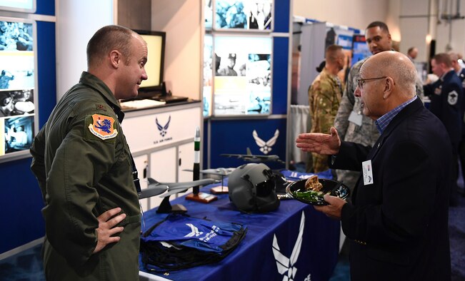 Airmen from Air Force Global Strike Command discuss their experiences and military backgrounds with those attending the Air Force Association’s Air, Space and Cyber Conference at National Harbor, Md., Sept. 19, 2016. Three major commands, AFGSC, Air Mobility Command, and Air Education and Training Command, were represented at the American Airman Booth. (U.S. Air Force photo/Tech. Sgt. Bryan Franks)
