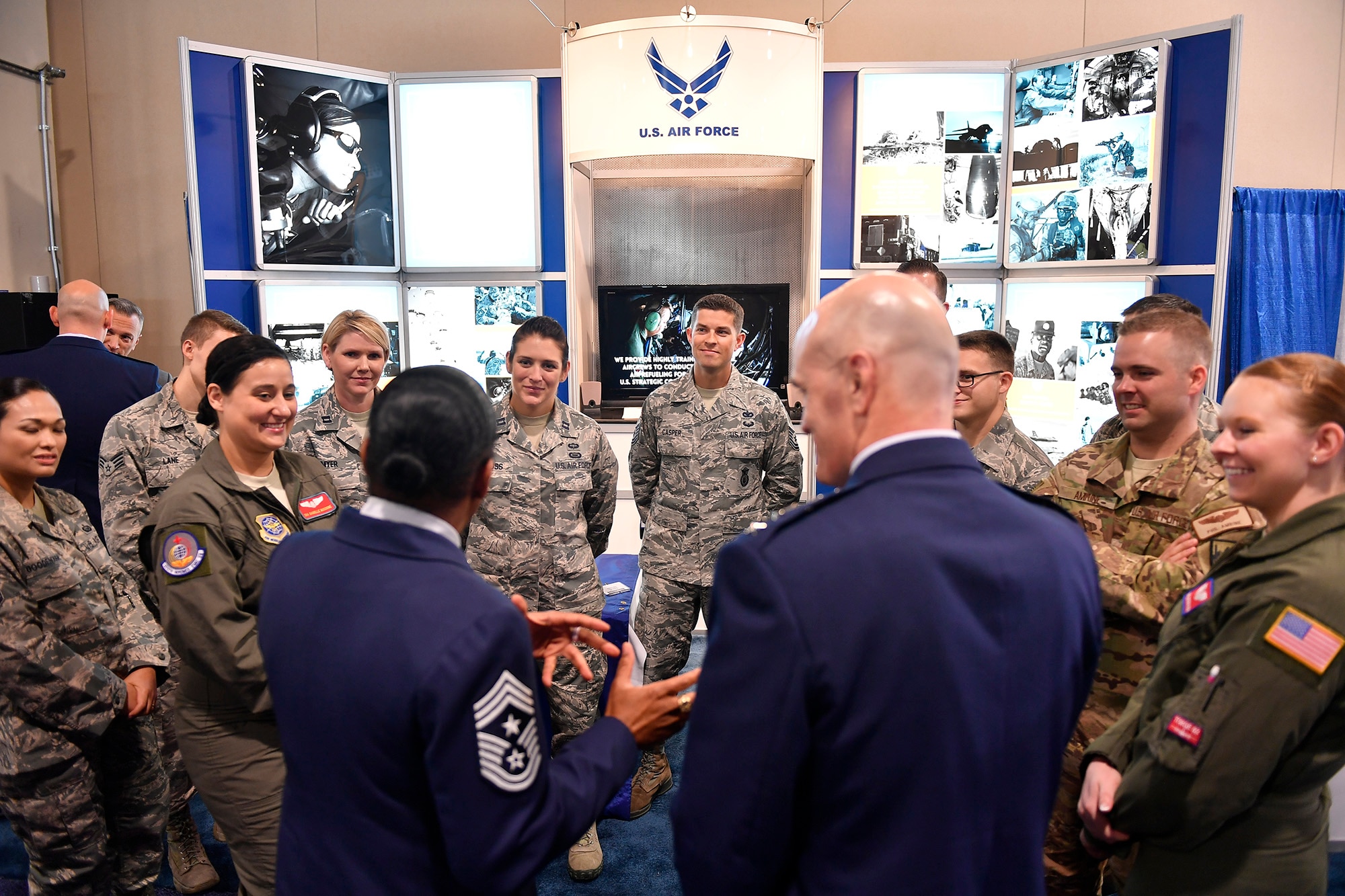 Airmen from Air Mobility Command discuss their experiences and military backgrounds with those attending the Air Force Association’s Air, Space and Cyber Conference at National Harbor, Md., Sept. 20, 2016. Three major commands, Air Force Global Strike Command, AMC, and Air Education and Training Command were represented at the American Airman Booth. (U.S. Air Force photo/Tech. Sgt. Anthony Nelson Jr.)