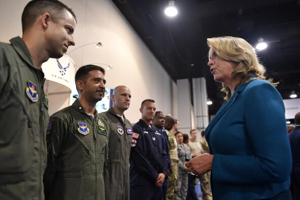 Secretary of the Air Force Deborah Lee James meets with Airmen from the Air Education and Training Command at the Air Force Association’s Air, Space and Cyber Conference in National Harbor, Md., Sept.19, 2016. Airmen were selected from Air Force Global Strike Command, Air Mobility Command, and AETC to man the American Airman Booth and represent their MAJCOMS at the conference. (U.S. Air Force photo/Tech. Sgt. Anthony Nelson Jr.)