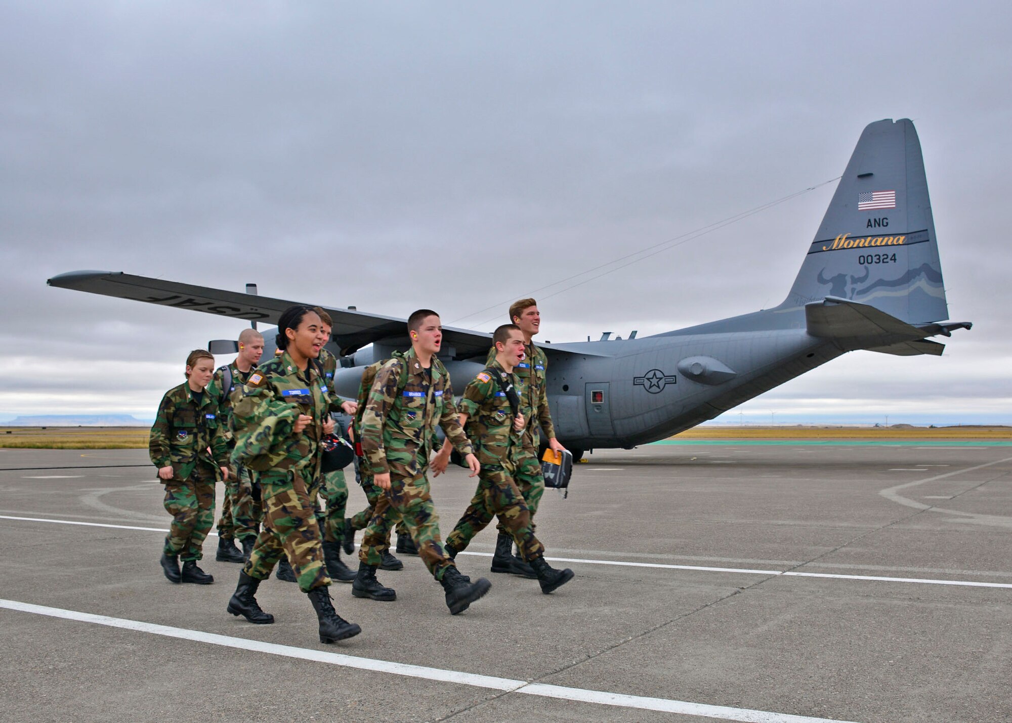 Civil Air Patrol cadets call cadence as they march to a C-130 Hercules transport aircraft assigned to the 120th Airlift Wing of the Montana Air National Guard. The cadets are assigned to the Malmstrom Air Force Base Composite Squadron of the Civil Air Patrol Montana Wing and were taking an orientation flight Sept. 13, 2016. (U.S. Air National Guard photo by Senior Master Sgt. Eric Peterson)