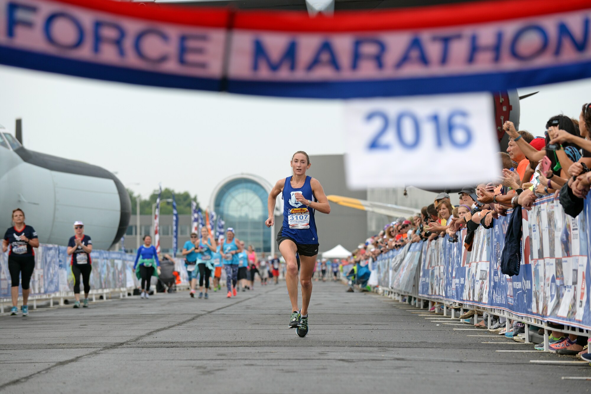 U.S. Air Force Staff Sgt. Emily Shertzer, an instrumentalist with the 553rd Air Force Band, races down the final stretch of the U.S. Air Force half-marathon Sept. 17, 2016, at Wright-Patterson A.F.B., Ohio. Shertzer, representing the Air National Guard marathon team, was the first female finisher in the half-marathon with a time of 1:22:40 (U.S. Air National Guard photo by Senior Master Sgt. Ralph Branson/Released)