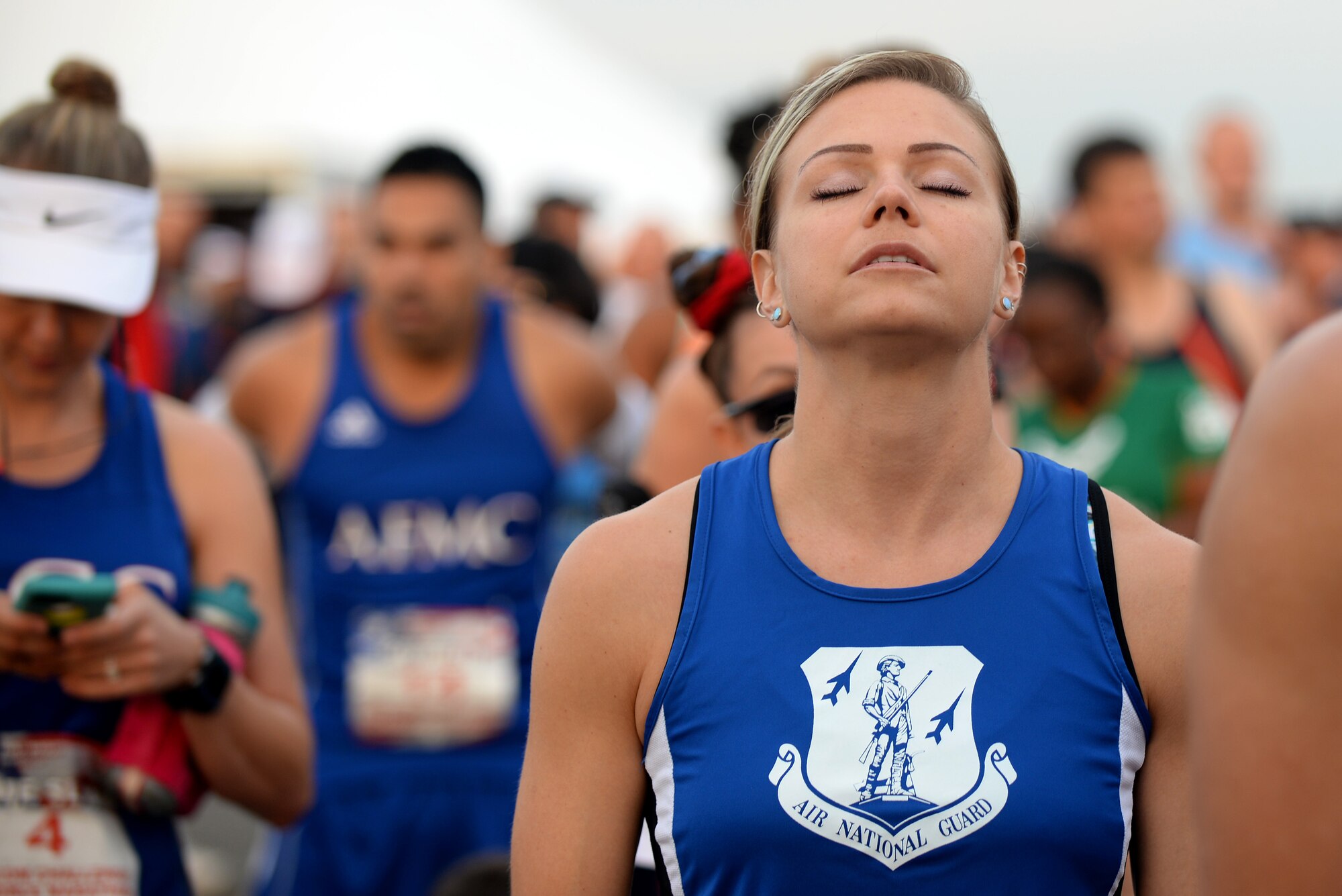 2nd Lt. Annelise Rowe, a security forces operations officer with the124th Fighter Wing , Idaho, tries to relax before the start of the Air Force Marathon Sepetember 17, 2016, at Wright Patterson A.F.B, Ohio. Rowe competed for the Air National Guard marathon team in the MAJCOM Challenge. (U.S. Air National Guard photo by Senior Master Sgt. Ralph Branson/Released)